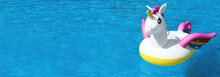 Funny Inflatable Unicorn Ring Floating In Swimming Pool On Sunny Day, Space For Text. Banner Design