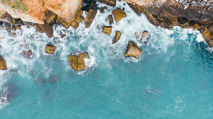 Wall Mural - Top down aerial view of sea water surface. White foam waves texture as natural background.