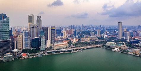 Wall Mural - View of the bay and city skyline with skyscrapers at sunrise in Singapore