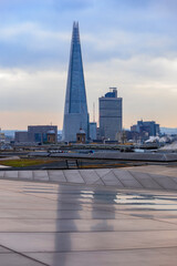 Poster - View of London skyline and the Shard skyscraper from One New Change shopping centre on a cloudy day in London, England