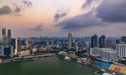 Wall Mural - View of the bay and city skyline with skyscrapers at sunrise in Singapore