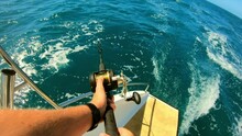 POV Shot Of Man Fishing In Sea From Moving Boat On Sunny Day - Great Barrier Reef, Lizard Island