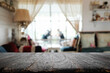 © qOppi - Empty wooden table space platform and blurred restaurant or coffee shop background for product display montage.