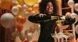 © Jacob Lund - Woman filling champagne into pyramid of glasses