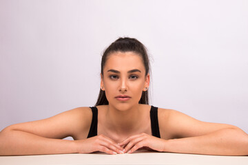 Beauty portrait of young woman with natural look, isolated on white. Nude make up, perfect skin, skin care concept