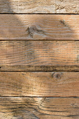 Wall Mural - wood barn wall plank texture background with light and shadow in the morning day, top view of old wooden table