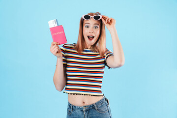 Poster - Image of charming excited woman holding passport with tickets