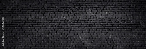 Fotomural Texture of a black painted brick wall as a background or wallpaper