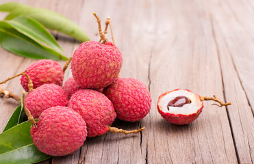 Fresh lychee from the garden Planted in an organic style that is delicious and placed on a wooden table.