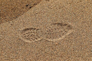 Footprint in the sand on a beach