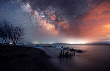 Beautiful Starry Sky With Bright Milky Way Galaxy Over The Lake. Night Landscape . 