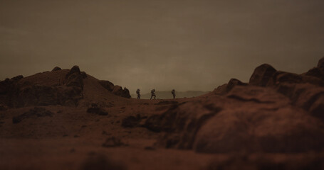 Wall Mural - three astronauts walking on a surface of a red rocky planet. mars colonization concept. planet creat