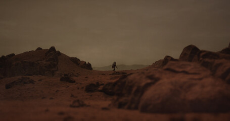 Wall Mural - lonely astronaut walking on a surface of a red rocky planet. mars colonization concept. planet creat
