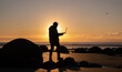 © tonklafoto - Asian man traveller visit at Moereki Boulder, New Zealand. Frelancer remotely worker.