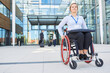 © Robert Kneschke - Businesswoman as a wheelchair user in front of the office