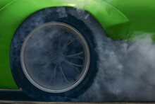 Race Car Drifting Free Wheels To Rub On The Road. Burning Rubber. Smoke.