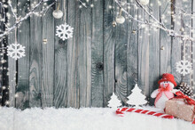 Decorative Christmas Background Composed Of A Snowman, A Giant Candy Stick And Various Gifts.