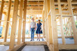 © leszekglasner - Couple make their dreams of building their own home come true visiting house under construction