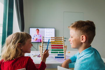 kids having online math lesson at home, distant learning
