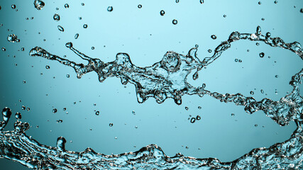 Water splash isolated on blue background, freeze motion