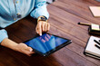 © Rymden - Woman pointing on digital tablet screen, chatting in social networks, meeting website, searching internet, sending sms, using text messenger or online banking. Close up photo