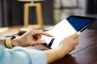 © Rymden - Woman pointing on digital tablet screen, chatting in social networks, meeting website, searching internet, sending sms, using text messenger or online banking. Close up photo