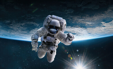 Leinwandbilder - Astronaut in the outer space with Sun over the planet Earth. Abstract wallpaper. Spaceman. Elements of this image furnished by NASA
