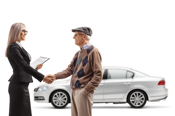 Poster - Businesswoman shaking hands with an elderly gentleman in front of a car