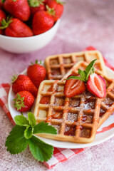 Delicious fresh baked belgian waffles with berries and fruit