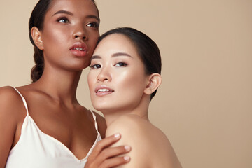 Wall Mural - beauty. diverse models portrait with copy space for advertising. tender asian and mixed race women p