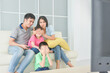 © gamelover - Asian family sitting on sofa and watching TV together.Mother closing daughter eyes by hands and son closing eyes by himself. Violence on TV programe concept.