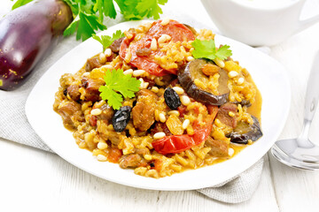 Wall Mural - Rice with vegetables and chicken in plate on wooden board