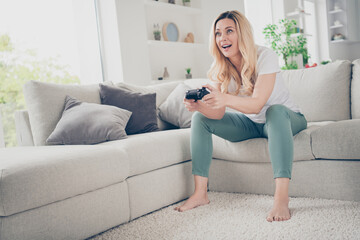 Sticker - Photo of beautiful cheerful lady relaxing sit comfy couch barefoot positive emotions playing video games stay home quarantine time excited addicted gamer winner victory living room indoors