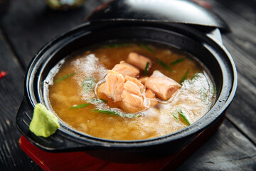Wall Mural - Ishikari miso soup with salmon in a black bowl