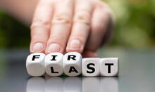 Hand Turns Dice And Changes The Word "last" To "first".
