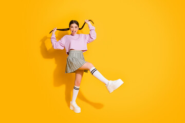 Poster - Portrait of funny childish youth hold her tails show tongue out feel foolish on spring weekend holiday wear plaid sneakers pullover isolated over bright color background