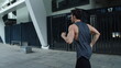 © stockbusters - Athlete man training obstacles run on city street. Fitness guy jogging outdoor.
