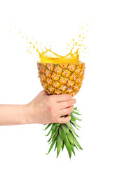 Wall Mural - pineapple in hand as glass with juice and splash