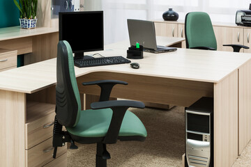 computer and laptop on desk modern office