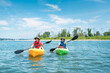 © romylee - father and son kayakers paddling in the Long Island Sound