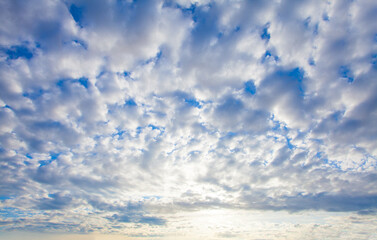 Sunset sky clouds background. Beautiful landscape with clouds and orange sun on sky