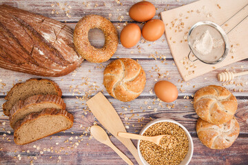 Healthy organic baking concept. Organic rye bread and organic healthy pastries on kitchen table 