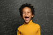© millaf (Nemchinova) - Happy child boy on chalkboard background with science formulas