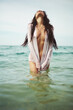 © Egor Mayer - Beautiful brunette woman sweams on sea