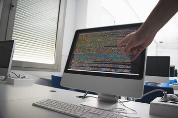 Student programming  with a computer in class
