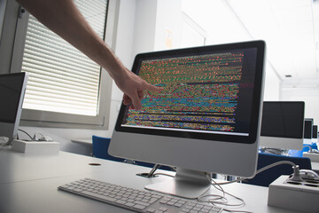 Student programming  with a computer in class