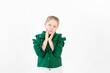 © Any Grant - a 6-7 year old girl on a white isolated background is surprised, a place for text