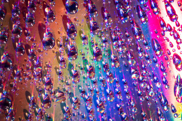 Wall Mural - water drops on dvd media, water drops on colorful background