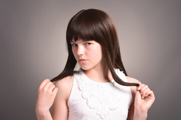 Portrait of cute girl with dark hair posing