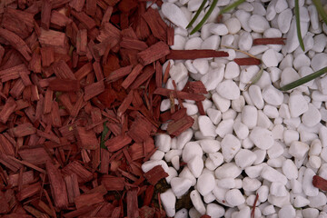 red wooden snippeds and white little stones for grave decoration